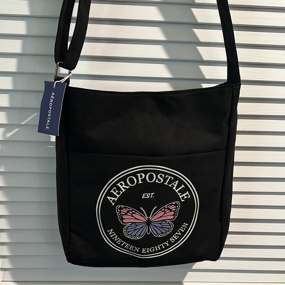 NWT Aeropostale 1987 Black Canvas Crossbody bag with adjustable Strap.
